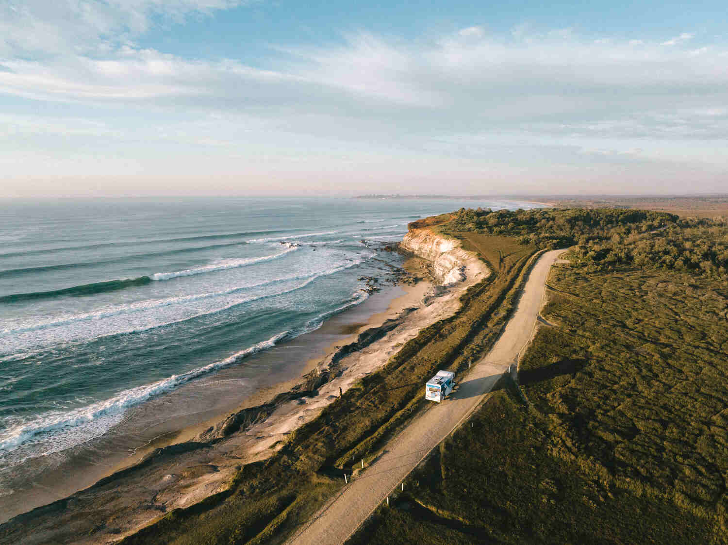 Drone shot of Star RV motorhome driving on coastal road